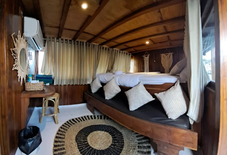 Wooden cabin bedroom for a private luxury travel experience in Indonesia