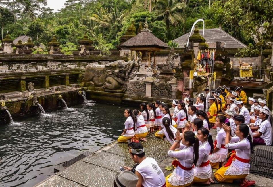 Balinese water temple ceremony during a family cultural tour in Indonesia