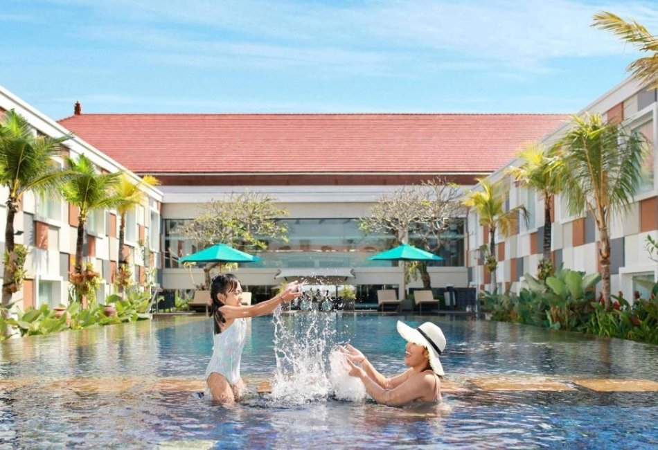Guests enjoying a resort pool during a stress-free luxury holiday in Indonesia