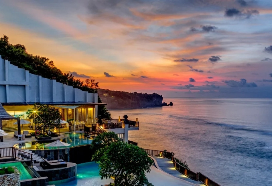 Luxury clifftop resort overlooking the ocean in Indonesia at sunset