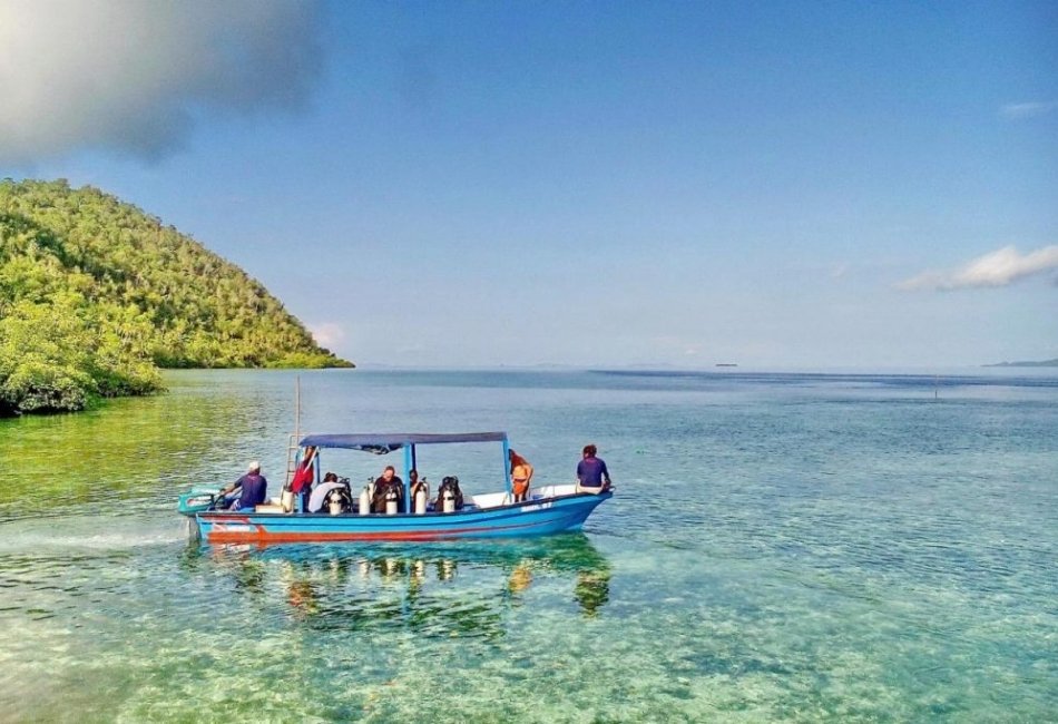 Private boat tour through clear tropical waters in Indonesia