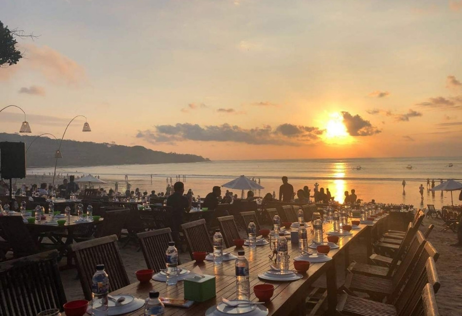 Luxury seafood dining at sunset in Jimbaran Bali Indonesia