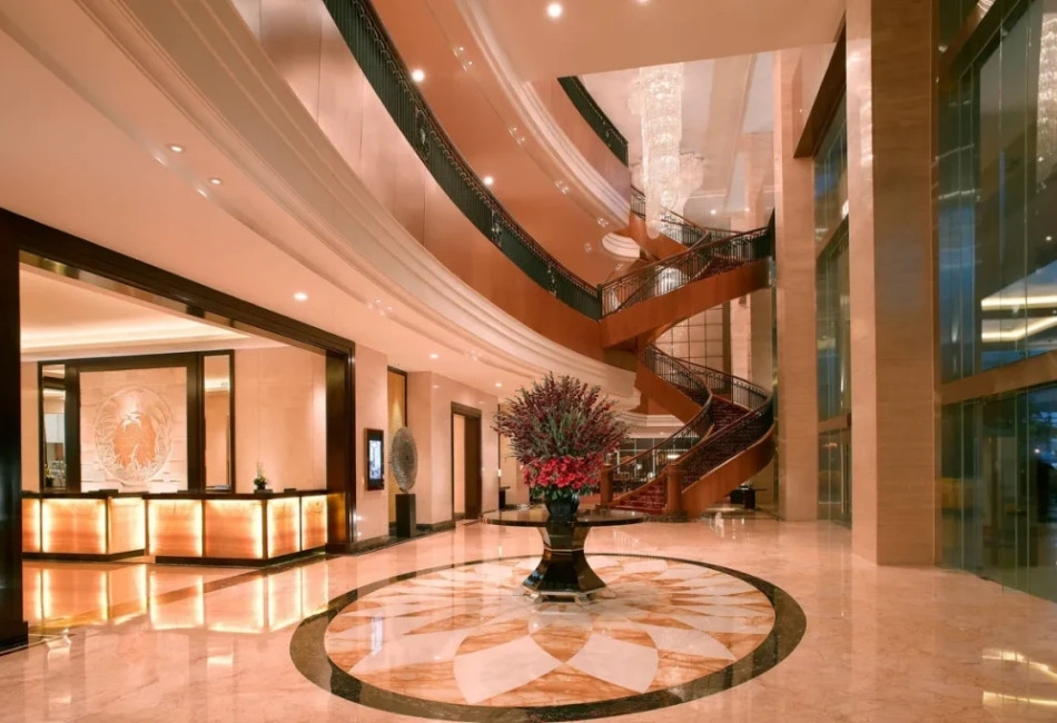 Luxury hotel lobby with grand staircase for an upscale travel experience in Indonesia (1)