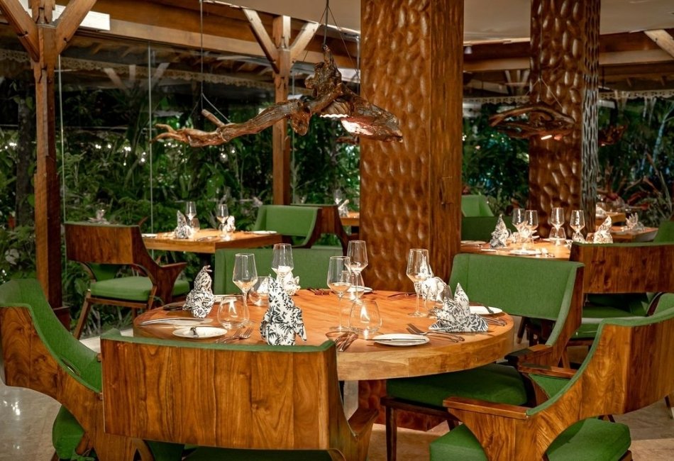 Luxury restaurant interior with wooden dining tables in Bali Indonesia