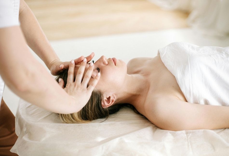 Woman Lying on Bed Having a Spa Treatment