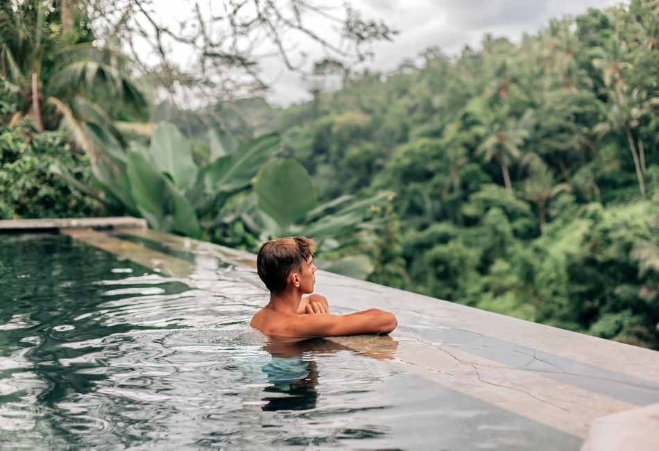 man relaxing in Bali Infinity Pool